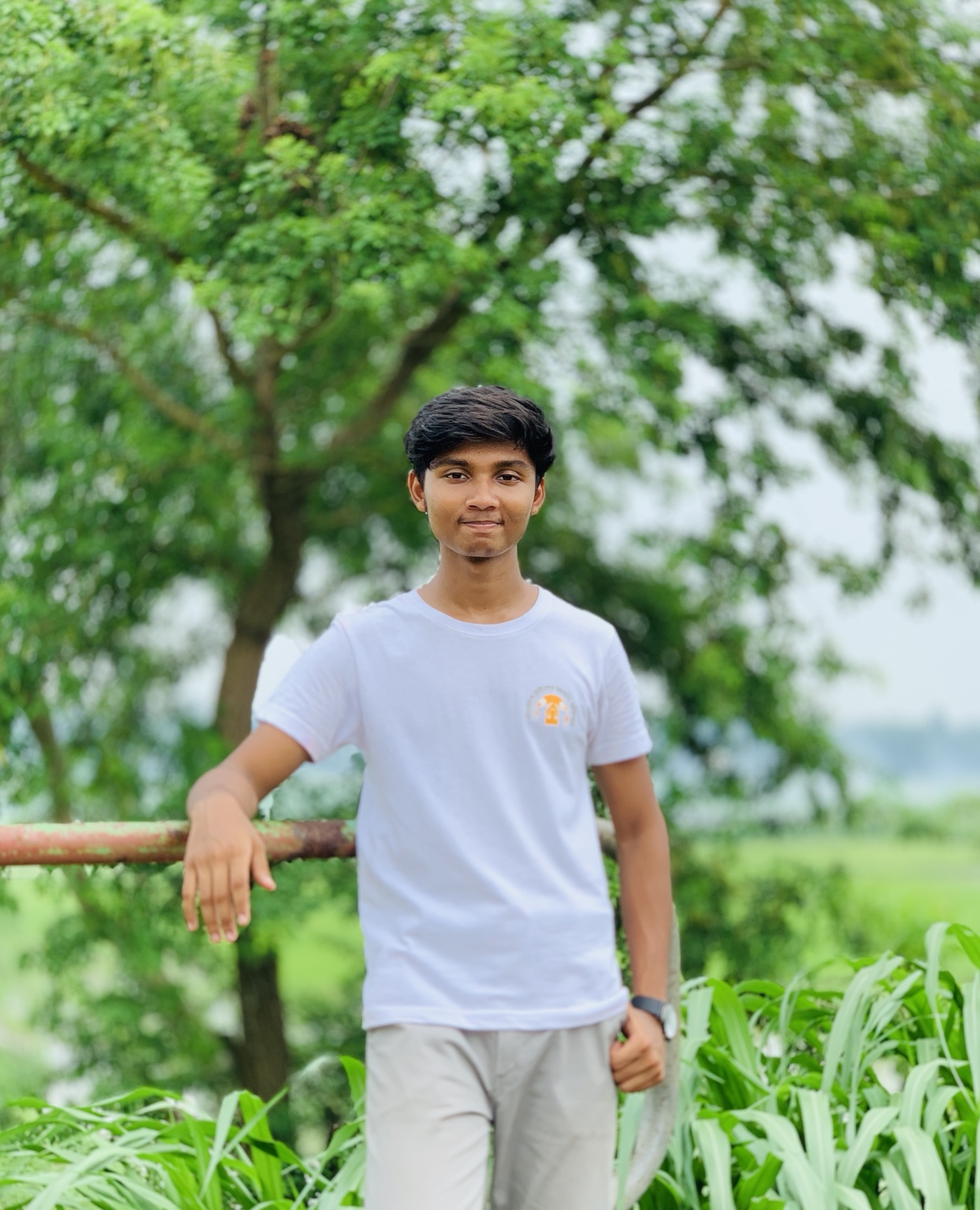 Tauhid Khan in a green landscape