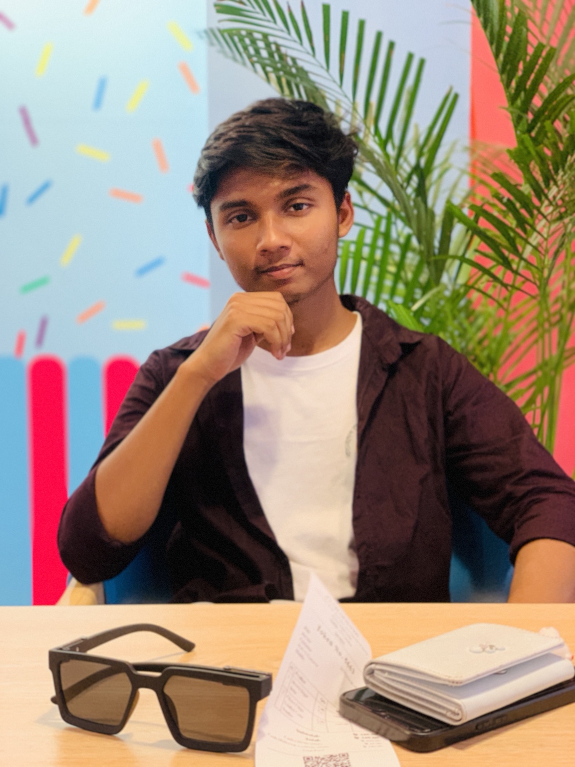 Tauhid Khan seated indoors